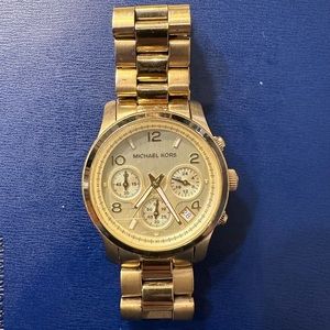 Women’s gold Michael Kors watch